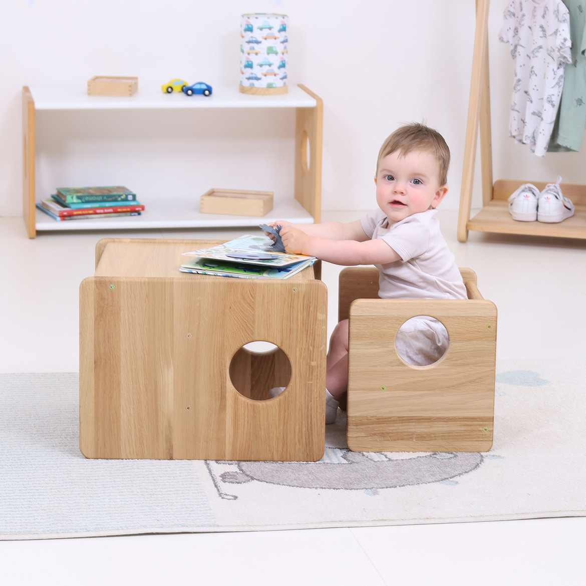 Lubo Majer for Brubi – toddler sitting with Cube Chair and Table set in oak wood, children's reversible furniture in nursery room