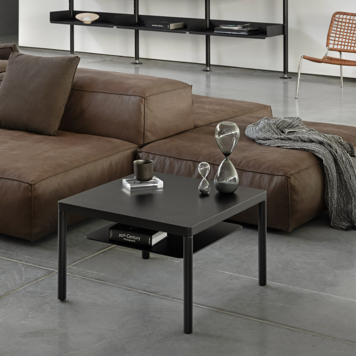 Lubo Majer for Take me HOME – Aldo coffee table black version in living room with leather sofa