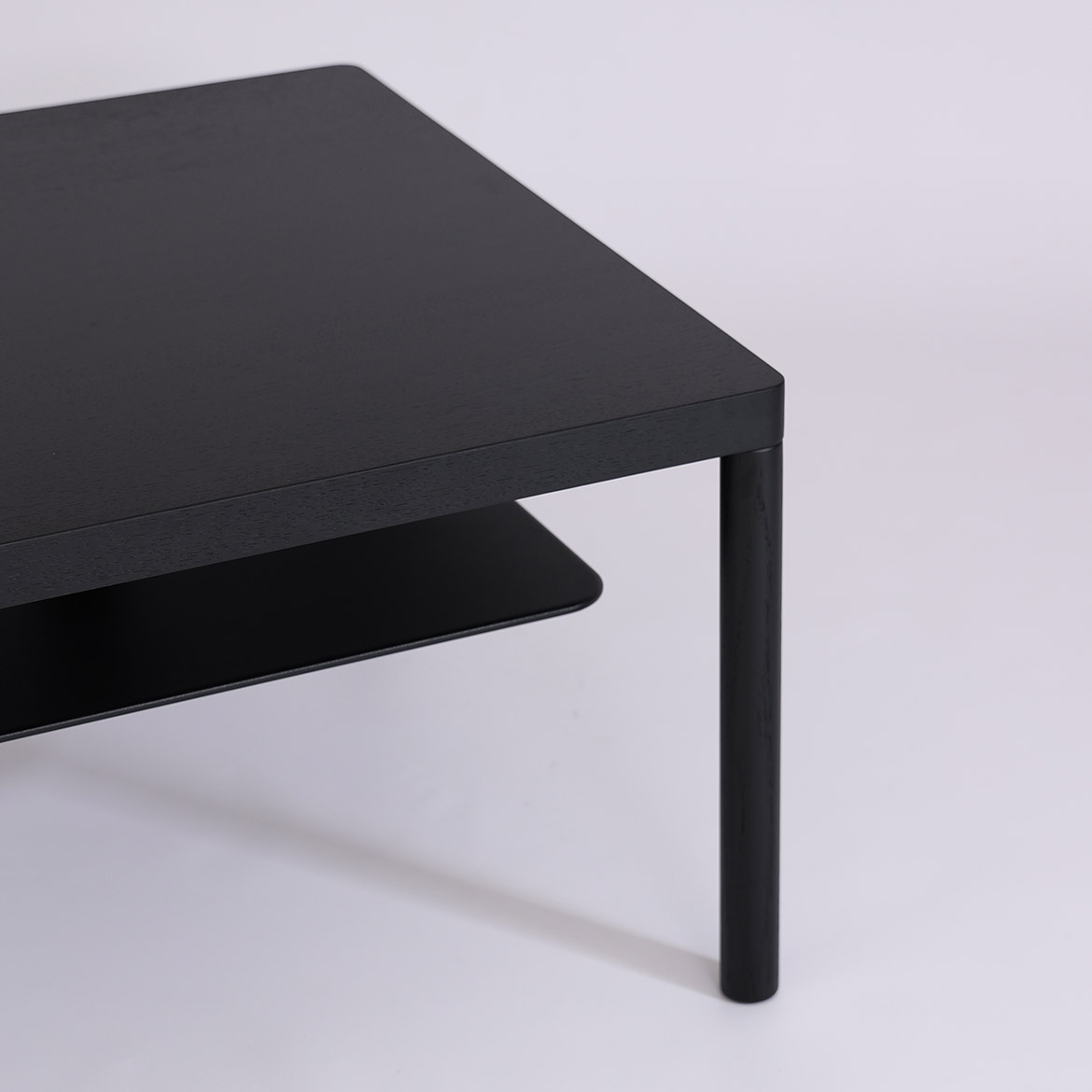 Lubo Majer for Take me HOME – Aldo coffee table black version, detail of oak leg and floating metal shelf